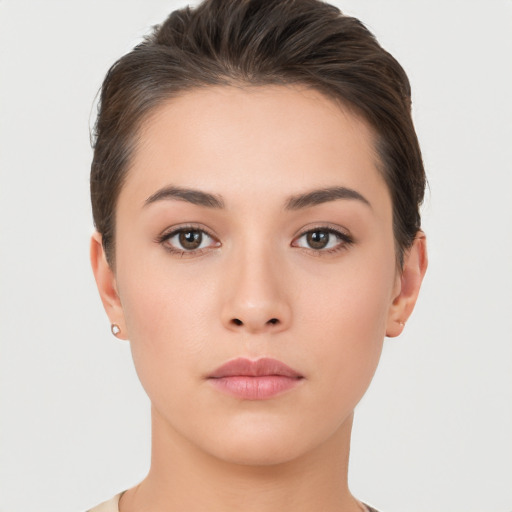 Neutral white young-adult female with short  brown hair and brown eyes