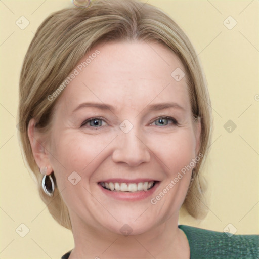 Joyful white adult female with medium  brown hair and blue eyes