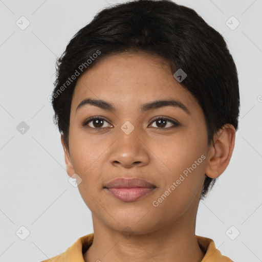 Joyful latino young-adult female with short  black hair and brown eyes