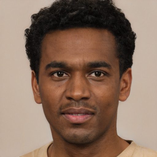 Neutral black young-adult male with short  black hair and brown eyes