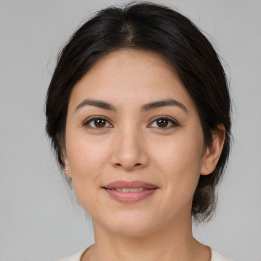Joyful white young-adult female with medium  brown hair and brown eyes