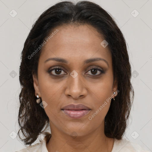 Joyful black young-adult female with medium  brown hair and brown eyes