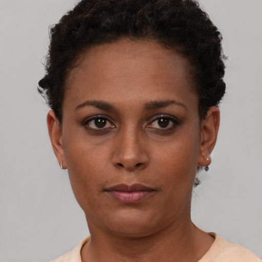 Neutral black young-adult female with short  brown hair and brown eyes