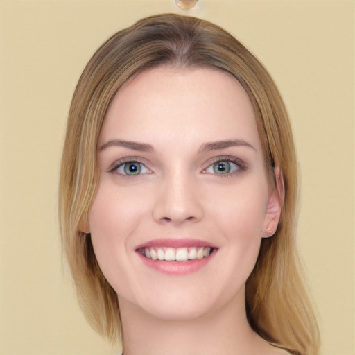 Joyful white young-adult female with long  brown hair and green eyes