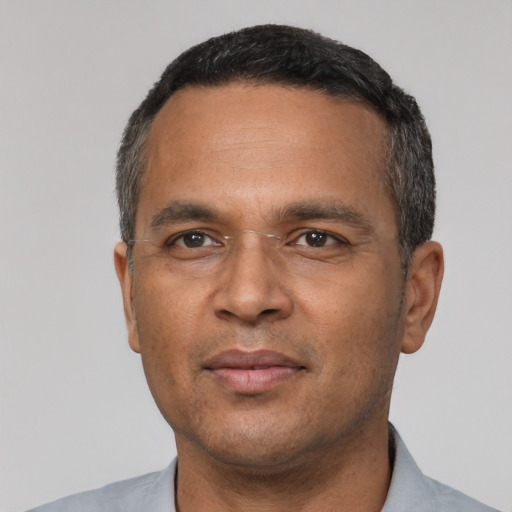 Neutral latino adult male with short  black hair and brown eyes
