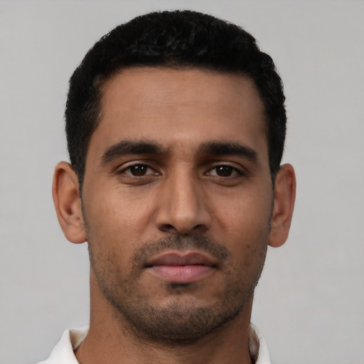 Neutral latino young-adult male with short  black hair and brown eyes