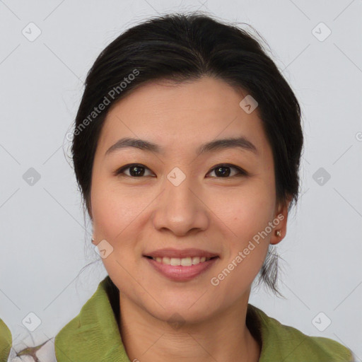 Joyful asian young-adult female with medium  brown hair and brown eyes