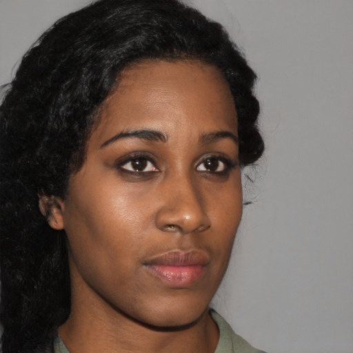 Neutral black young-adult female with medium  black hair and brown eyes