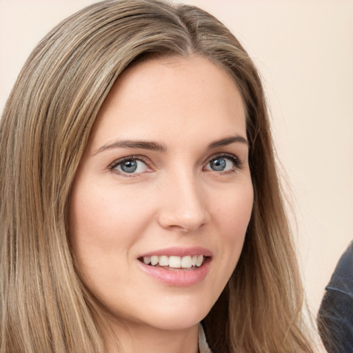 Joyful white young-adult female with long  brown hair and grey eyes