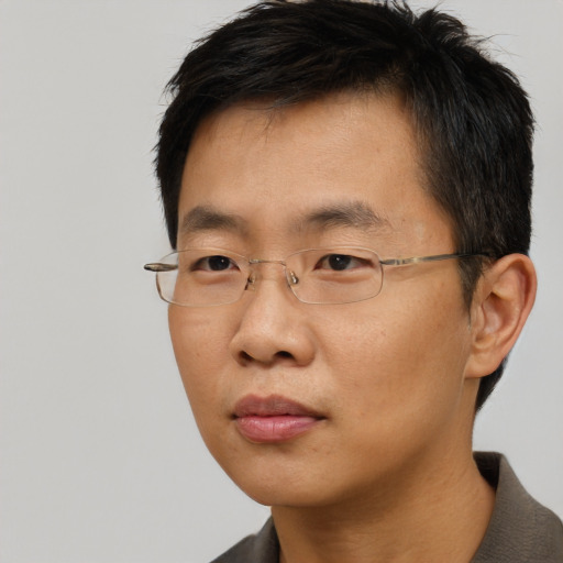 Neutral asian adult male with short  black hair and brown eyes