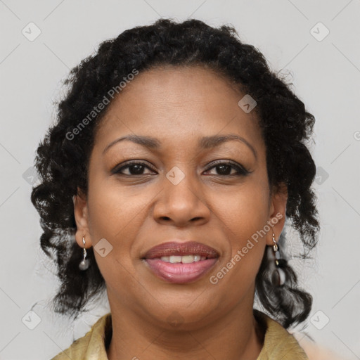 Joyful black adult female with medium  brown hair and brown eyes