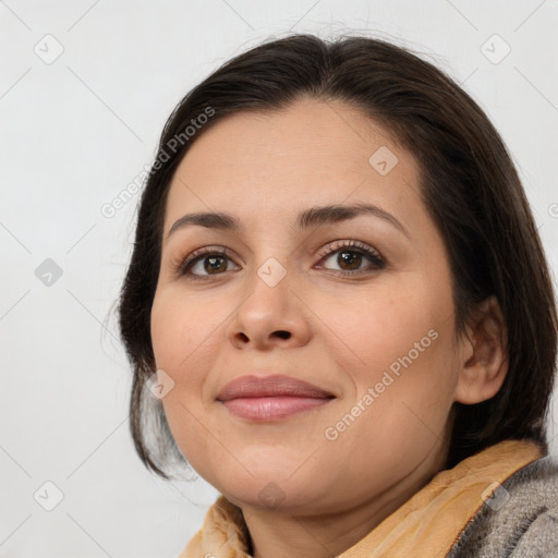 Joyful white young-adult female with medium  brown hair and brown eyes