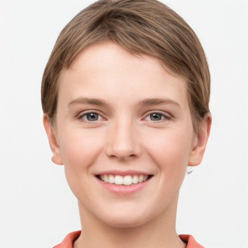 Joyful white young-adult female with short  brown hair and grey eyes