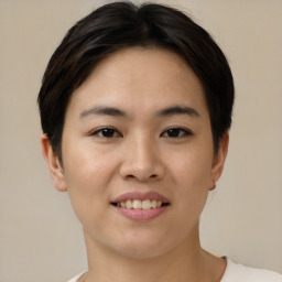 Joyful asian young-adult female with short  brown hair and brown eyes