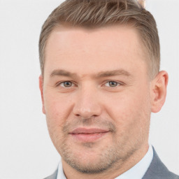 Joyful white adult male with short  brown hair and brown eyes