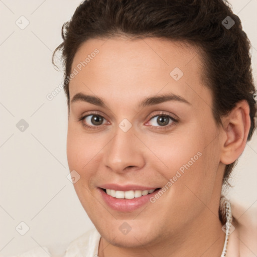 Joyful white young-adult female with medium  brown hair and brown eyes