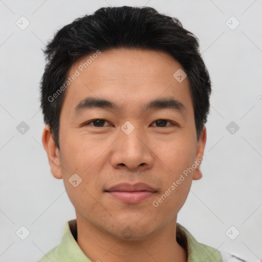 Joyful asian young-adult male with short  black hair and brown eyes