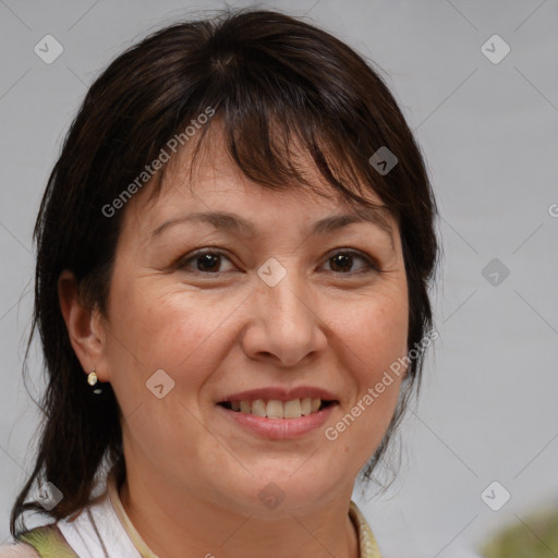 Joyful white adult female with medium  brown hair and brown eyes