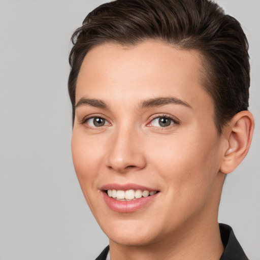 Joyful white young-adult female with short  brown hair and brown eyes