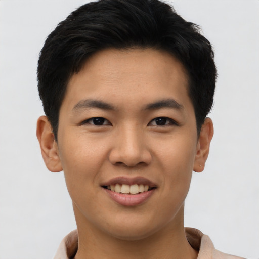 Joyful asian young-adult male with short  brown hair and brown eyes