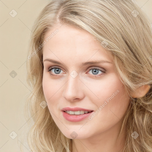 Joyful white young-adult female with long  brown hair and blue eyes