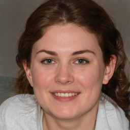 Joyful white young-adult female with medium  brown hair and blue eyes