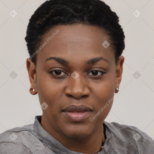 Joyful black young-adult female with short  black hair and brown eyes