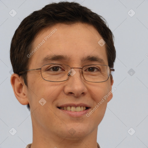 Joyful white adult male with short  brown hair and brown eyes