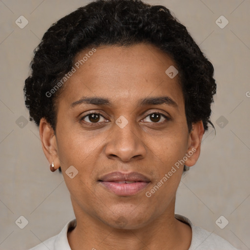 Joyful black adult female with short  brown hair and brown eyes