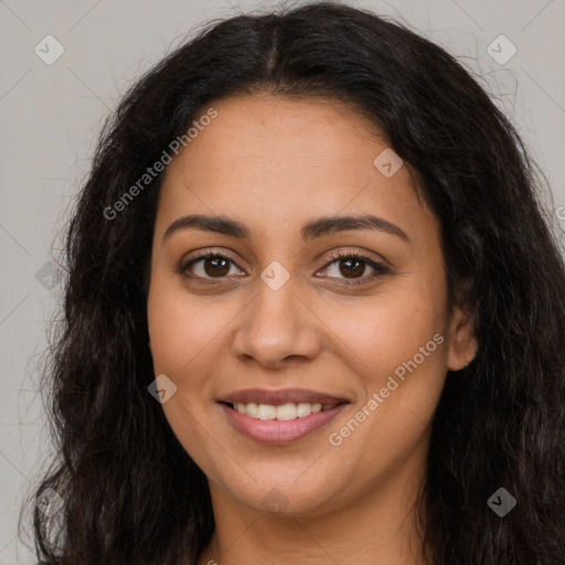 Joyful latino young-adult female with long  brown hair and brown eyes