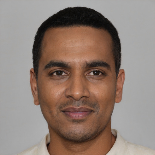 Neutral black young-adult male with short  black hair and brown eyes