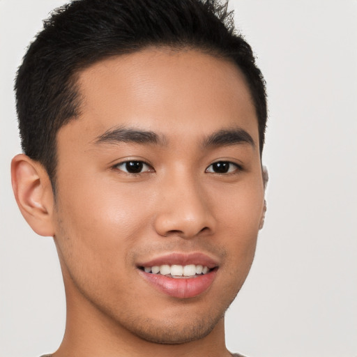 Joyful asian young-adult male with short  brown hair and brown eyes