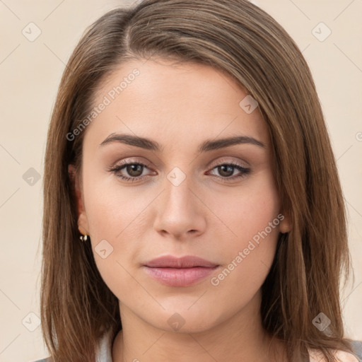 Neutral white young-adult female with long  brown hair and brown eyes