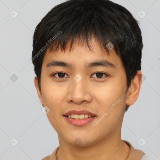 Joyful asian young-adult male with short  black hair and brown eyes