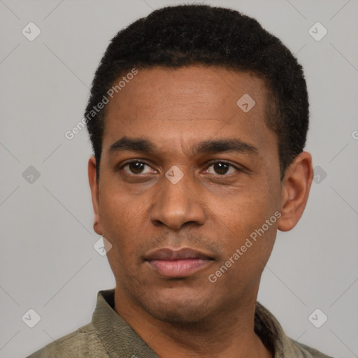 Neutral latino young-adult male with short  black hair and brown eyes