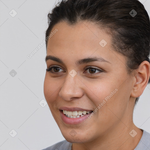 Joyful white young-adult female with short  brown hair and brown eyes