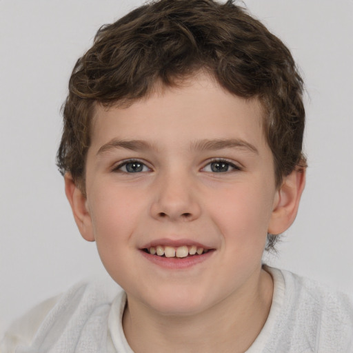 Joyful white child male with short  brown hair and brown eyes