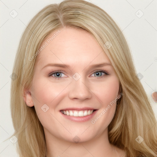 Joyful white young-adult female with long  brown hair and blue eyes