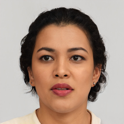 Neutral latino young-adult female with short  black hair and brown eyes
