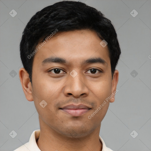 Joyful latino young-adult male with short  black hair and brown eyes