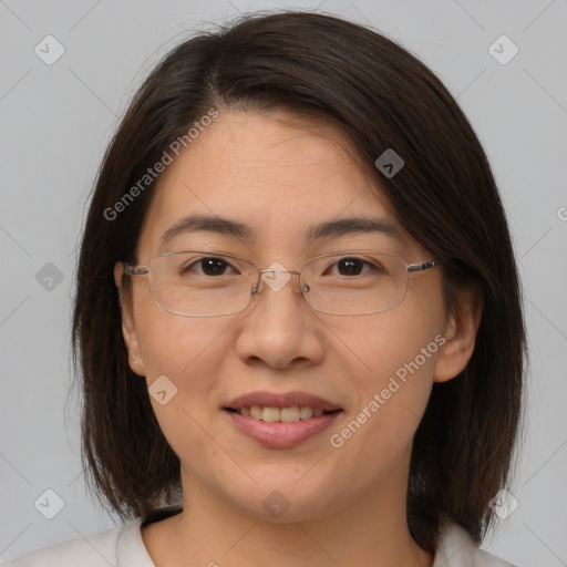 Joyful white adult female with medium  brown hair and brown eyes