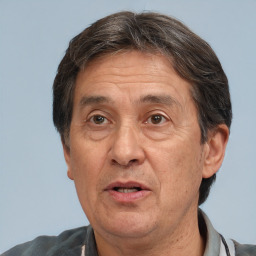 Joyful white middle-aged male with short  brown hair and brown eyes