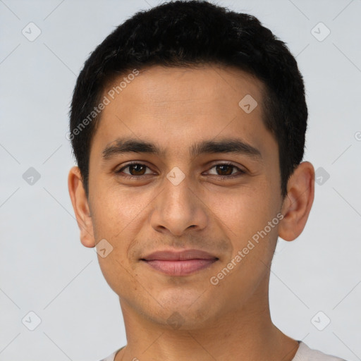 Joyful latino young-adult male with short  black hair and brown eyes