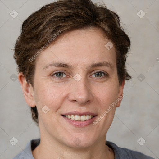 Joyful white adult female with short  brown hair and grey eyes