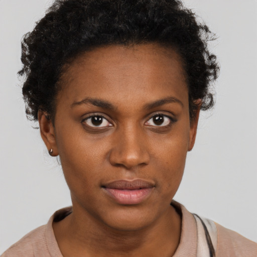 Neutral black young-adult female with short  brown hair and brown eyes