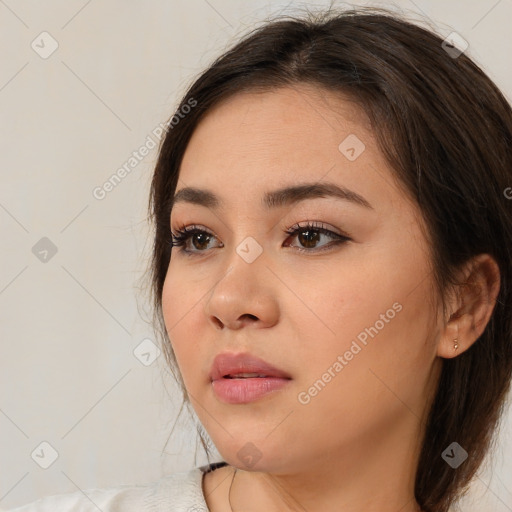 Neutral white young-adult female with medium  brown hair and brown eyes