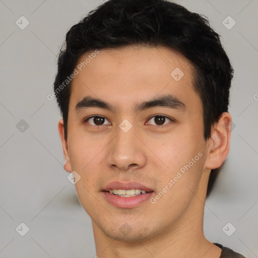 Joyful asian young-adult male with short  black hair and brown eyes