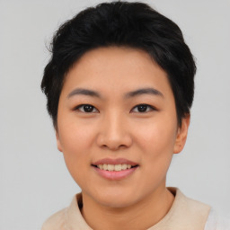 Joyful asian young-adult female with short  black hair and brown eyes