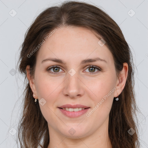 Joyful white young-adult female with long  brown hair and grey eyes