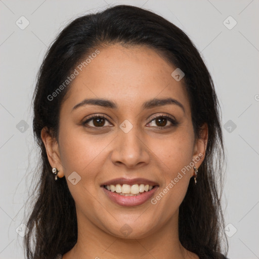 Joyful latino young-adult female with long  brown hair and brown eyes